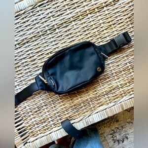 Lululemon Large Size black crossbody - with gold details.
